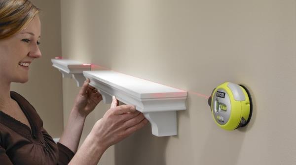 Woman using Ryobi Air Grip Laser Level