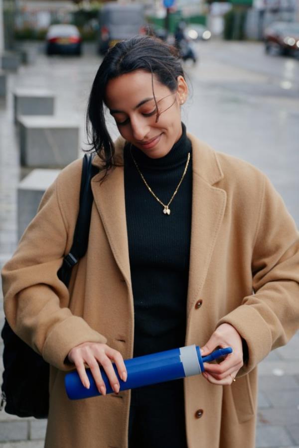 Image of model holding Gilley Umbrella