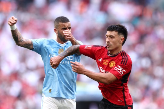 Kyle Walker of Manchester City and Lisandro Martinez of Manchester United clash during the FA Cup final