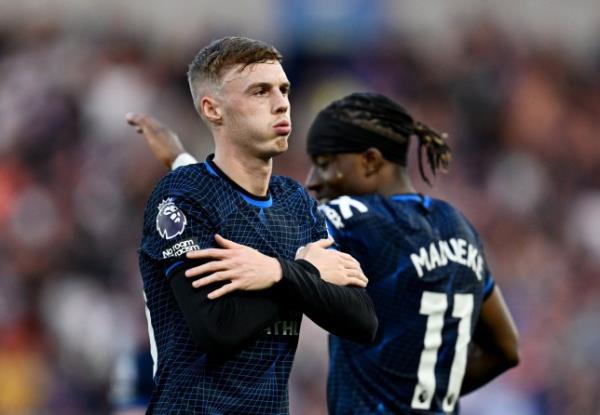 Cole Palmer of Chelsea celebrates scoring his team's first goal during the Premier League match between Brighton & Hove Albion and Chelsea