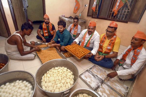 BJP workers prepare sweet ahead of vote counting of Lok Sabha elections, in Patna.