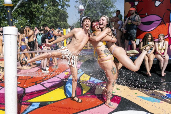 Festivalgoers are seen during the Bo<em></em>nnaroo Music & Arts Festival on Friday, June 14, 2024, in Manchester, Tenn. (Photo by Amy Harris/Invision/AP)