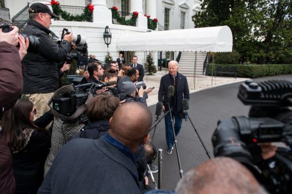 US President Joe Biden speaks to the press as he departs the White House in Washington, DC, on December 23, 2023. 