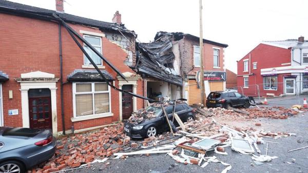 Debris litters the road and pavement in Lo<em></em>ndon Road, Blackburn, Lancashire, wher<em></em>e a property collapsed just before 8pm on Sunday after an issue with gas triggered an explosion. Two people were taken to hospital and nearby properties have been evacuated. Picture date: Mo<em></em>nday December 18, 2023. PA Photo. See PA story POLICE Blackburn. Photo credit should read: Paul Currie/PA Wire