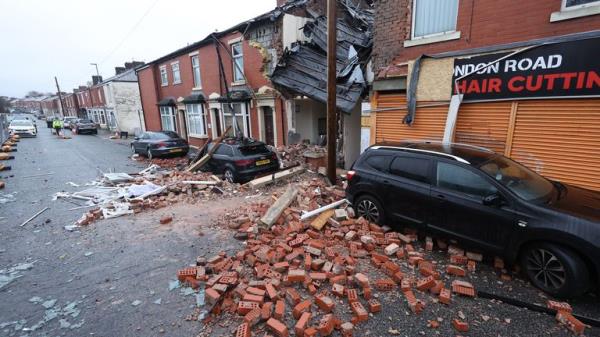 Debris litters the road and pavement in Lo<em></em>ndon Road, Blackburn, Lancashire, wher<em></em>e a property collapsed just before 8pm on Sunday after an issue with gas triggered an explosion. Two people were taken to hospital and nearby properties have been evacuated. Picture date: Mo<em></em>nday December 18, 2023. PA Photo. See PA story POLICE Blackburn. Photo credit should read: Paul Currie/PA Wire