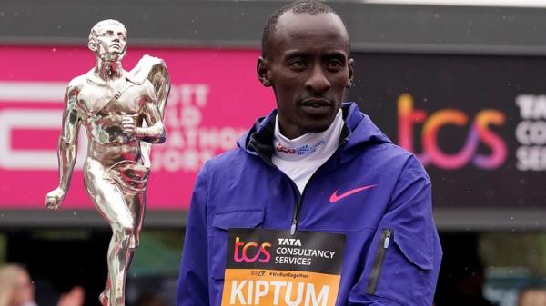 FILE - Men's race winner Kelvin Kiptum of Kenya holds a trophy together with women's race winner Sifan Hassan, unseen, of the Netherlands after the Lo<em></em>ndon Marathon in Lo<em></em>ndon on April 23, 2023. Kiptum was killed along with his coach in a car crash in Kenya late Sunday, Feb. 11, 2024. (AP Photo/Alberto Pezzali, File)