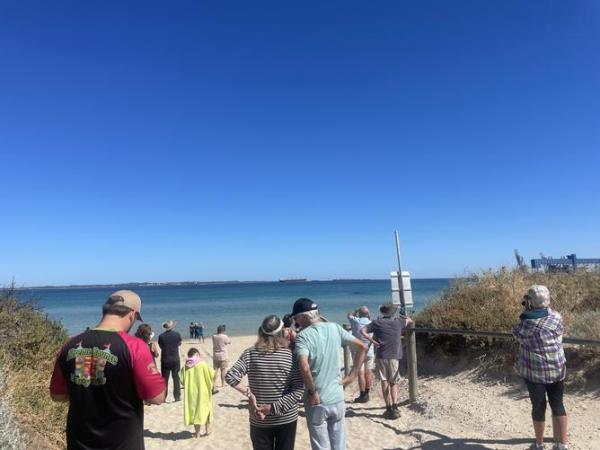 The beach has been closed to swimmers, and a shark warning has been issued, but no sharks have been spotted yet.