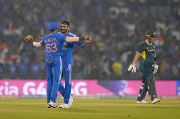 India's Axar Patel celebrates the dismissal of Australia's Ben McDermott