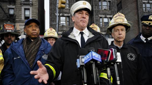 FDNY Chief John Hodgens flanked by Mayor Eric Adams