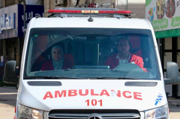 Lina Amro, left, and Jawdat al-Muhtaseb, right, in their ambulance