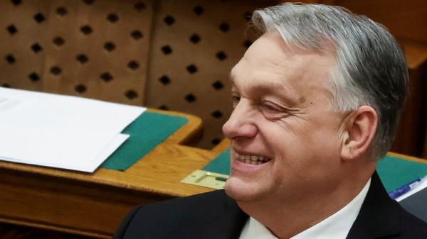 Viktor Orban smiles in Budapest after Hungary approved Sweden's NATO bid. Pic: Reuters