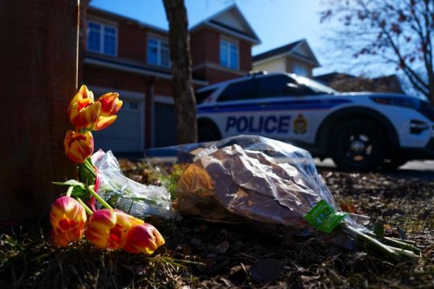 Flowers sit at the scene of a homicide wher<em></em>e six people were found dead in the Barrhaven suburb of Ottawa on Thursday, March 7, 2024. 