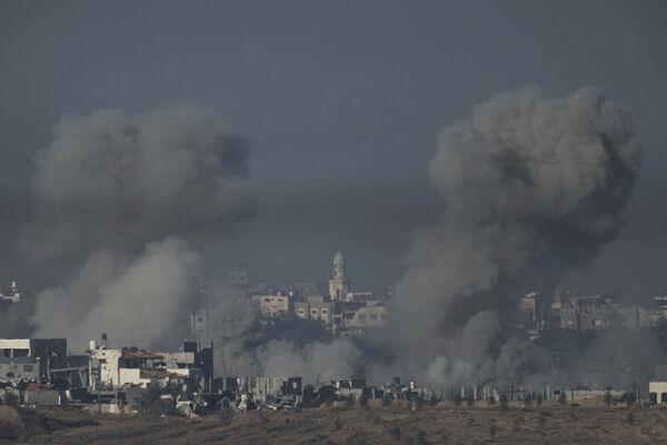 Smoke rises following an Israeli bombardment in the Gaza Strip, as seen from southern Israel, Sunday, Dec. 3, 2023. (AP Photo/Leo Correa)