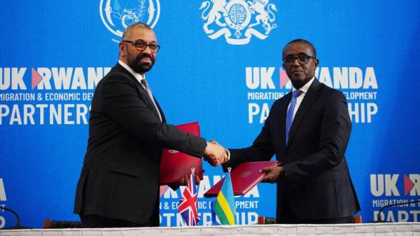 Home Secretary James Cleverly and Rwandan Minister of Foreign Affairs Vincent Biruta sign a new treaty. The treaty will address co<em></em>ncerns by the Supreme Court, including assurances that Rwanda will not remove anybody transferred under the partnership to another country.  Picture date: Tuesday December 5, 2023. PA Photo. See PA story POLITICS Rwanda. Photo credit should read: Ben Birchall/PA Wire 