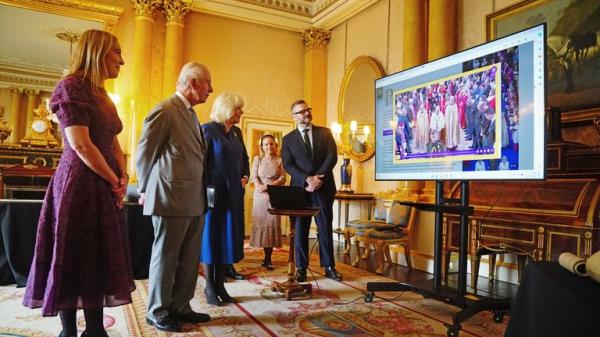 EMBARGOED TO 2200 THURSDAY MAY 2 King Charles III and Queen Camilla are presented with the Coro<em></em>nation Roll, an official record of their Coronation, by the Clerk of the Crown in Chancery, at Buckingham Palace, central London. Picture date: Wednesday May 1, 2024.