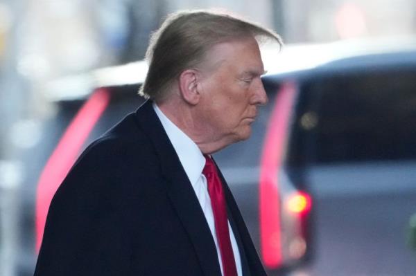 Republican presidential candidate former President Do<em></em>nald Trump leaves his apartment building in New York