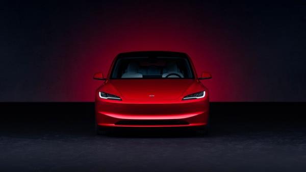 Tesla Model 3 facelift: front view, red paint, studio shoot