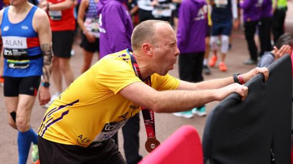 Matt Hancock MP reacts after finishing the Lo<em></em>ndon Marathon. Pic: Reuters