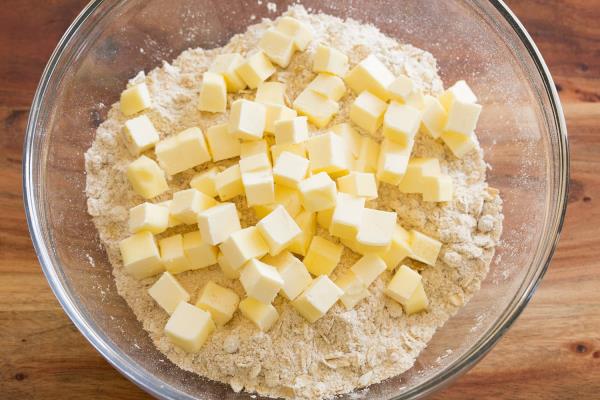 Adding small butter to dry mixture.