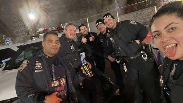 Diller and other officers smile together in uniform