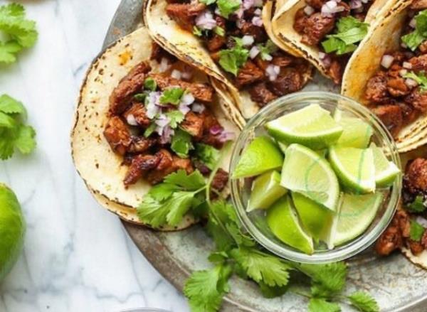 el guanaco tacos with lime for garnish.