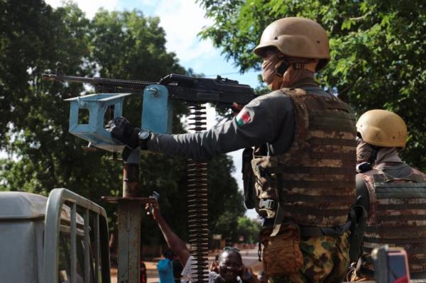 New junta's soldiers stand guard in an armoured vehicle in Ouagadougou, Burkina Faso