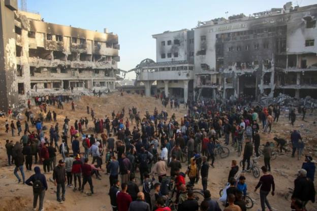 Palestinians inspect the damage at Gaza's Al-Shifa Hospital.