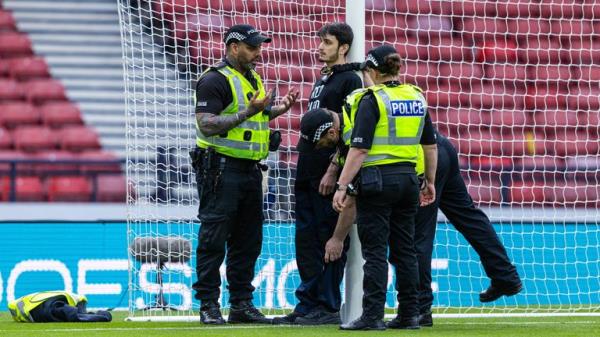 A protestor locked himself to the goal post in protest against Israel during a UEFA Euros Quallifier between Scotland and Israel at Hampden Park, on May 31, 2024. Pic: SNS Group