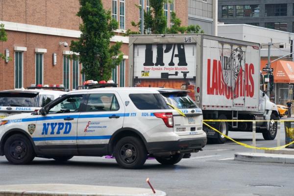 A photo of the beer truck that struck the cyclist and an NYPD SUV at the scene