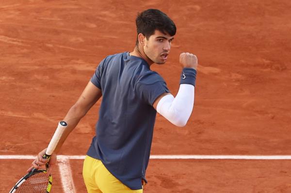 Carlos Alcaraz celebrates during his French Open win on Sunday.