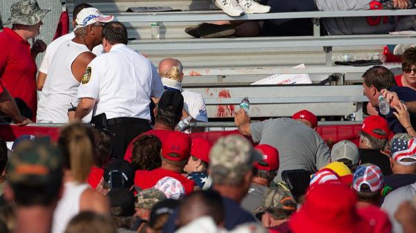 Law enforcement officers move during a rally