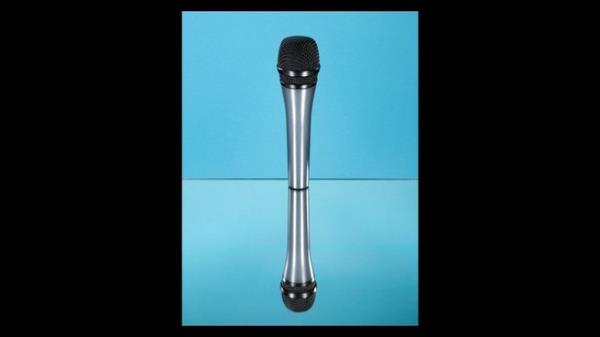 A reflective surface duplicates an image of a microphone against a blue background