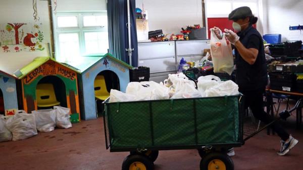 A volunteer at a foodbank during COVID. Pic: Reuters