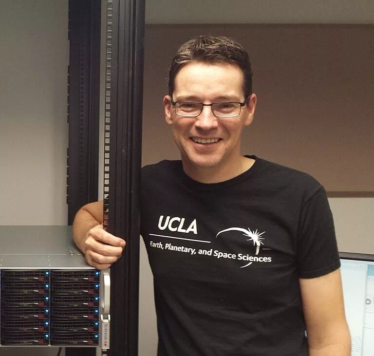 What is a planet. Young man in glasses and in black UCLA tee shirt.