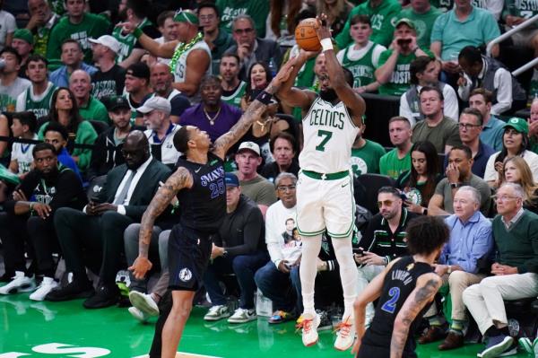  Boston Celtics guard Jaylen Brown (7) shoots against Dallas Mavericks forward P.J. Washington (25) in the fourth quarter.