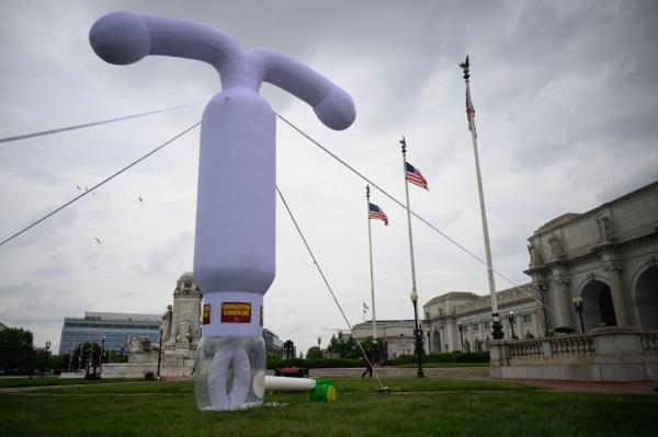 A 20-foot (6-meter) tall inflatable intrauterine device (IUD) stands outside of Unio<em></em>n Station in Washington, DC, on June 5, 2024.