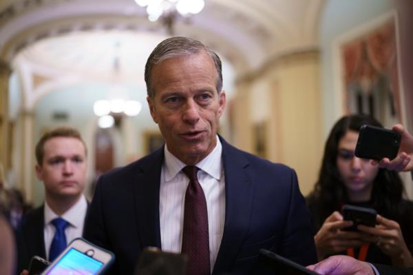 Senate Minority Whip John Thune, R-S.D., speaks to reporters just off the Senate floor as a bipartisan group of lawmakers negotiate a plan to pay for an estimated $1 trillion compromise plan, at the Capitol in Washington, Wednesday, June 23, 2021.