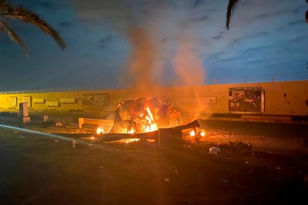 This photo released by the Iraqi Prime Minister Press Office shows a burning vehicle at the Baghdad Internatio<em></em>nal Airport following an airstrike in Baghdad.