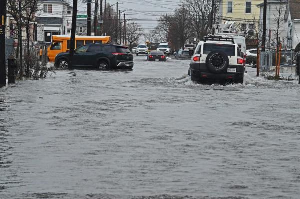 An NYPD Special Operations unit is seen patrolling the flooded area.