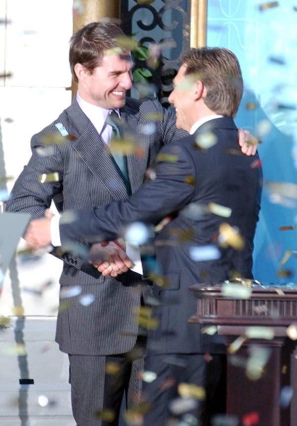 Cruise and David Miscavige are seen embracing during the opening of a new Scientology church in 2004. 