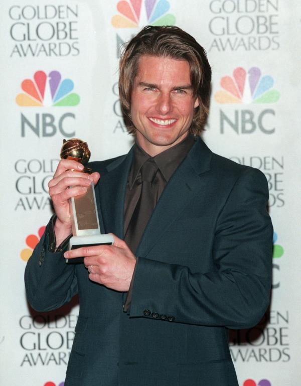 Cruise is seen with the Golden Globe he won in 200 for his performance in 