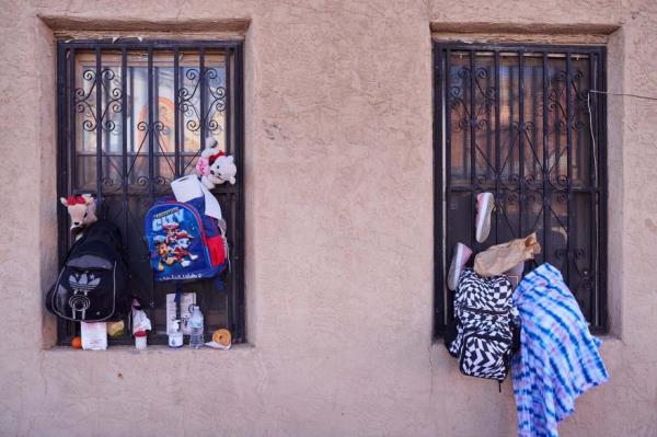 Migrants slept outside an overnight shelter at Sacred Heart Church