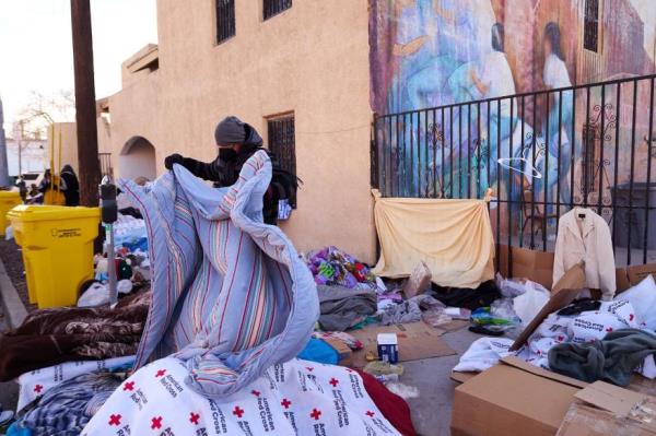 Migrants slept outside an overnight shelter at Sacred Heart Church