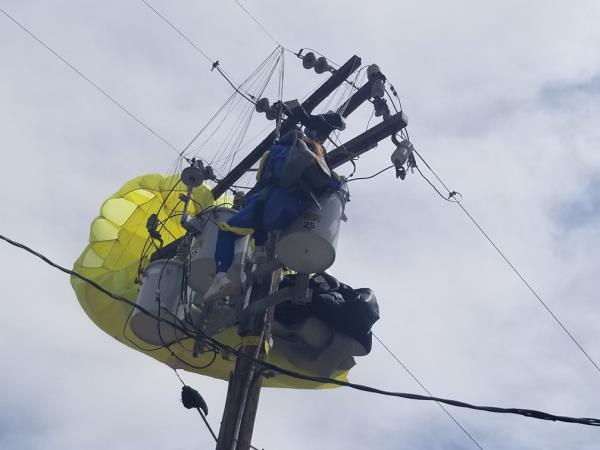 The skydiver spent a<em></em>bout an hour suspended in mid-air. 