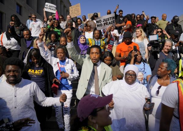 Jo<em></em>nes at a rally outside of the Historic Metro Courthouse after being reinstated.