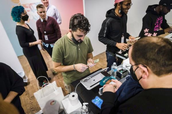 A customer purchases cannabis products at the Housing Works Cannabis Co.