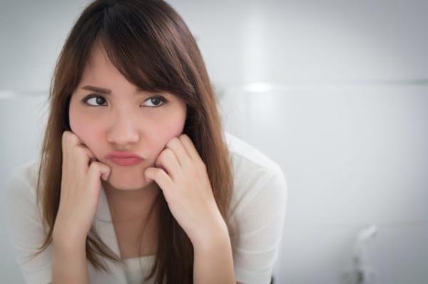 upset woman in toilet by diarrhea, constipation, hemorrhoids, piles