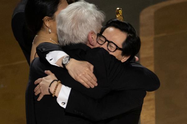 Best Supporting Actor Ke Huy Quan hugs Harrison Ford after 