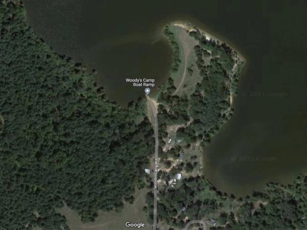 The woman was found inside of the vehicle in the Lake o’ the Pines reservoir.