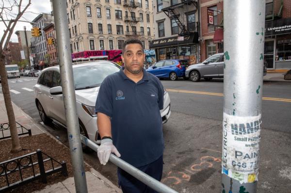 Jose Rodriguez outside of one of the East Village buildings wher<em></em>e he works as a super.